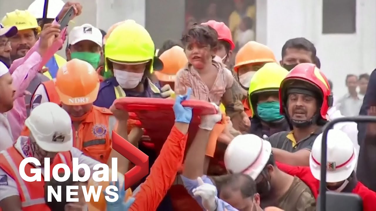Child pulled from the rubble following deadly building collapse ...