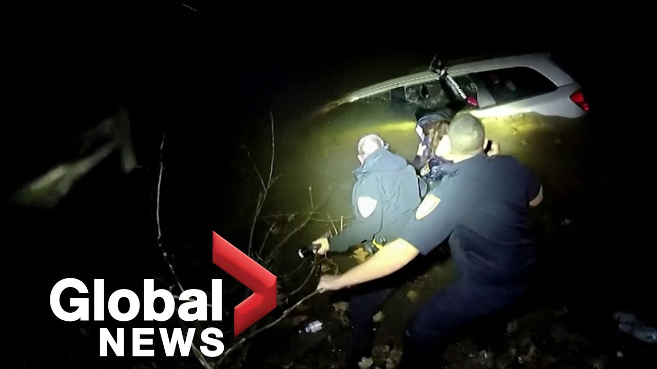 Dramatic bodycam footage shows moment police rescue woman trapped in ...