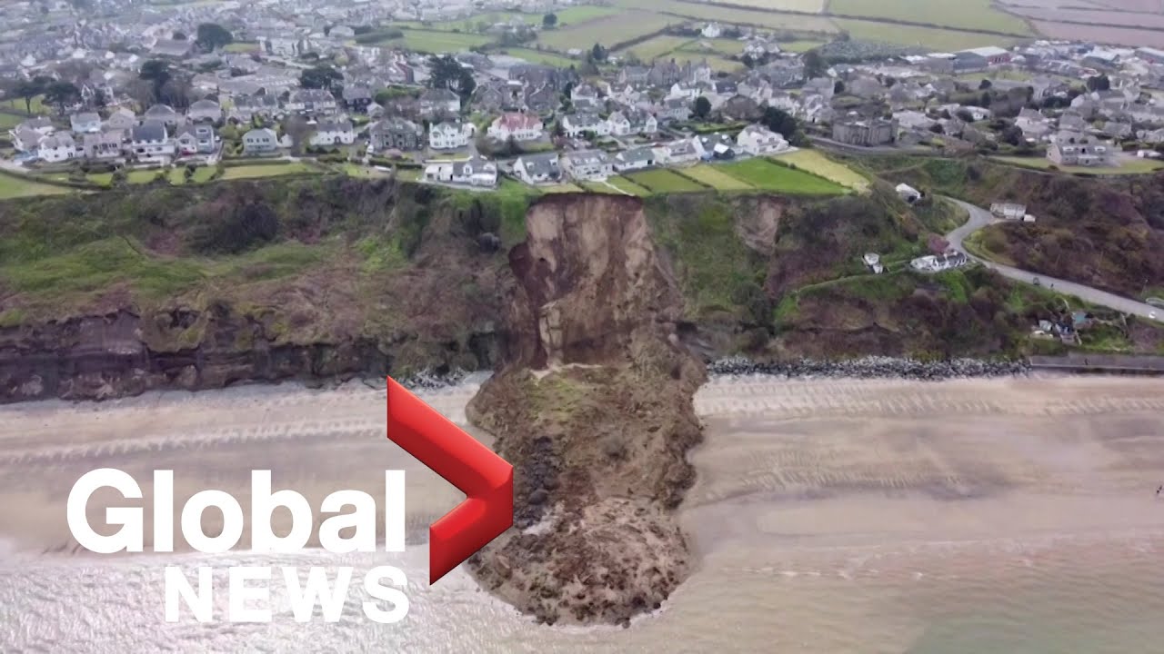 Drone video shows houses teetering on cliff edge after landslide in ...