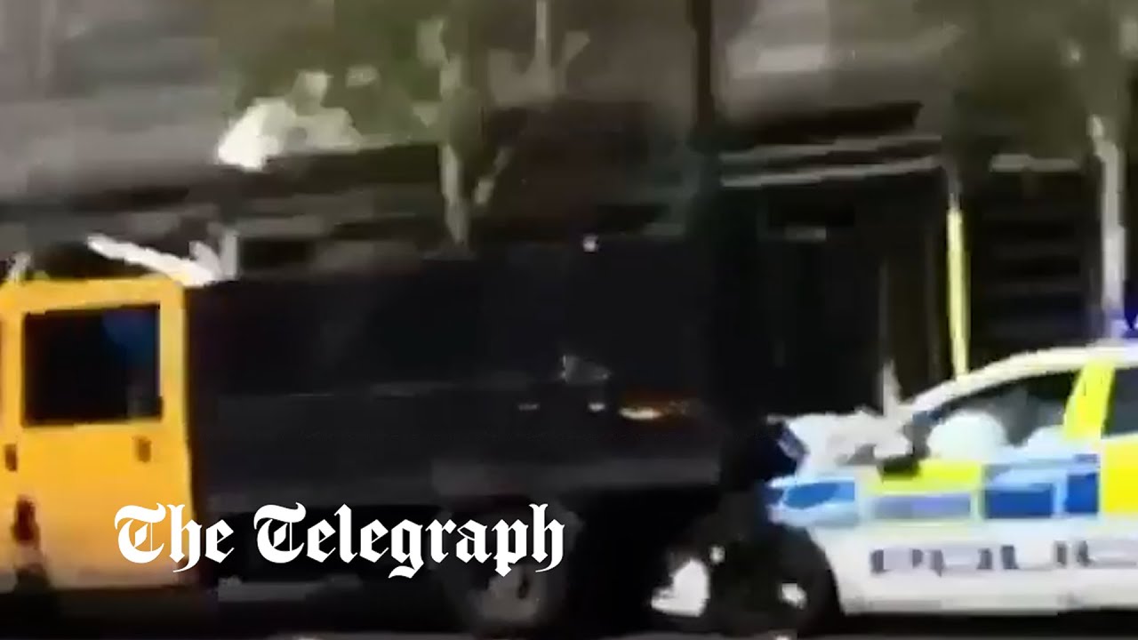 Moment van rams into police car injuring officer in south London - The ...