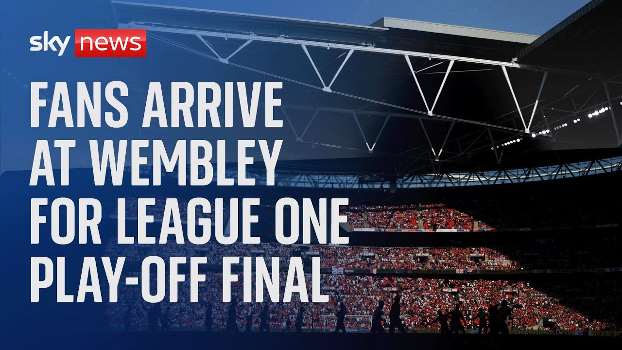 Watch live Football fans arrive at Wembley Stadium for the League One