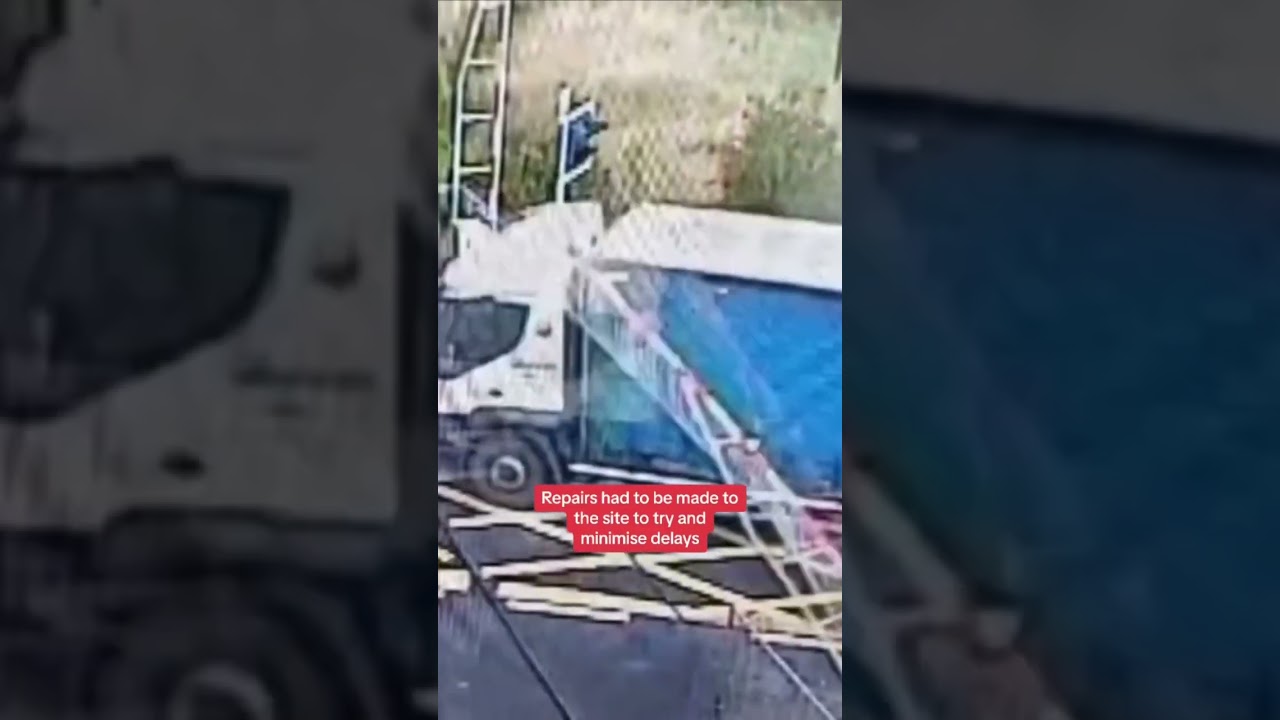 Truck smashes through barriers at level crossing causing rail delays ...