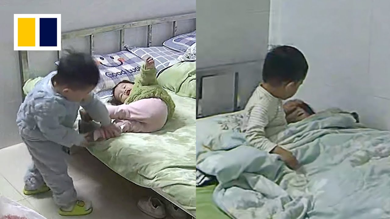 Boy puts little sister to sleep while mother is at work - The Global Herald